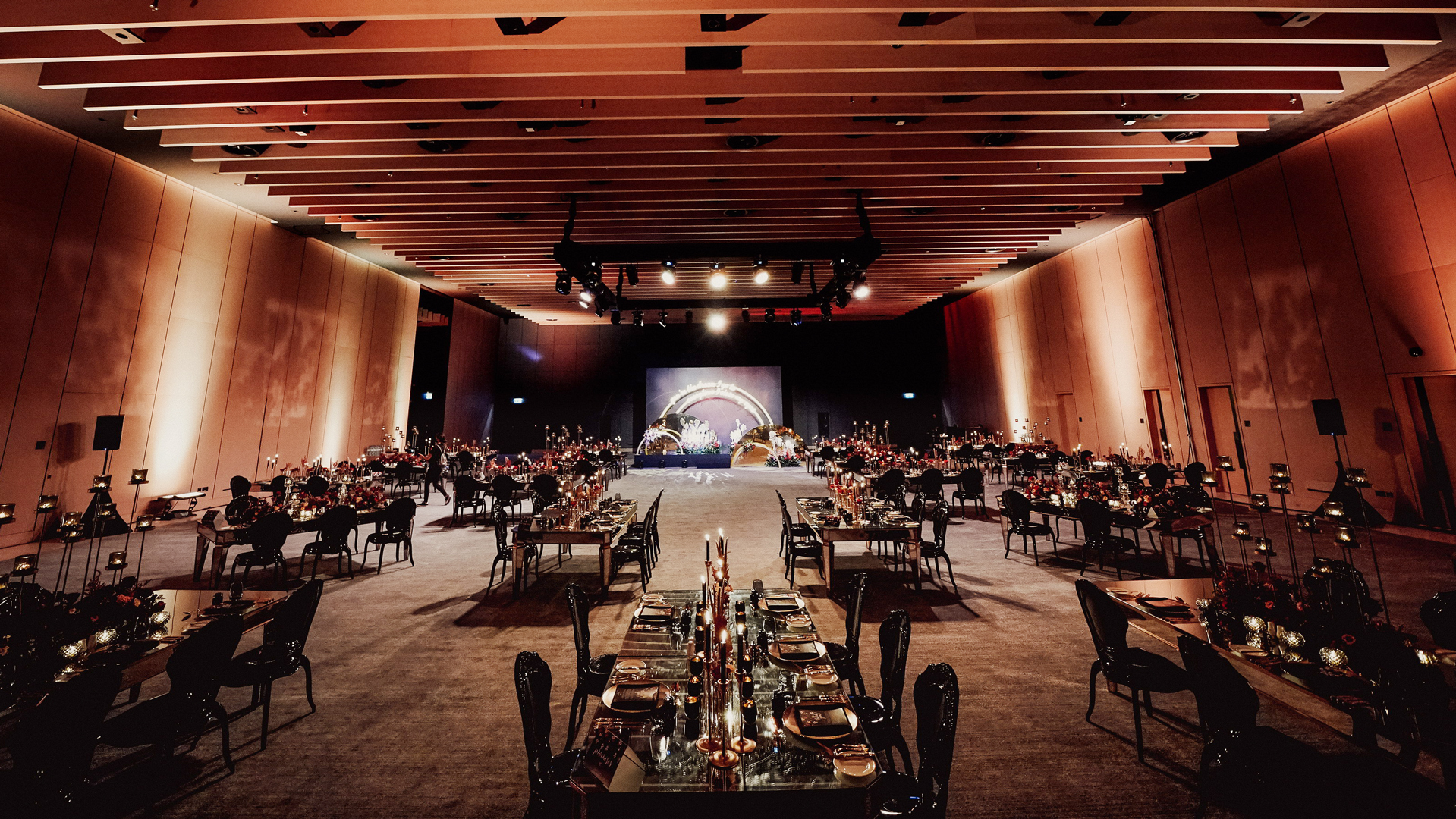 Elegant dining tables set for a banquet in Banyan Tree Dubai's grand event hall.